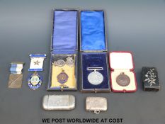 A collection of various medals, vesta cases etc, includes WWII defence medal, Masonic,