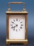 A c1900 French brass carriage clock in original carry case with receipt for recent overhaul