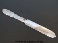A hallmarked silver letter opener with engraved floral decoration to the handle, Birmingham 1901,