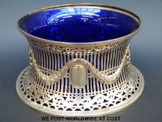 A hallmarked pierced silver large flared bowl or potato ring decorated with swags & fleur de lys,