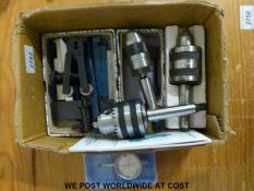 A quantity of lathe tools to include chucks, rotating centre clamps,