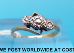 A 9ct gold ring set with three diamonds in a platinum setting (size H)