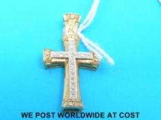 A 9ct gold cross set with diamonds
