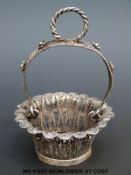 A white metal filigree basket,