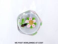 William Manson faceted glass paperweight with bee on a pink,