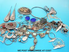 A collection of silver jewellery including eight pairs of earrings, a brooch set with agate,