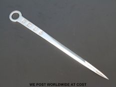 A hallmarked silver letter opener formed as a meat skewer with feature hallmarked for Sheffield