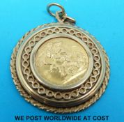 A yellow metal pendant set with a 1974 gold full sovereign (14.