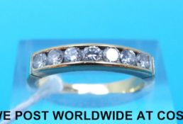 An 18ct gold ring set with seven diamonds (size M)