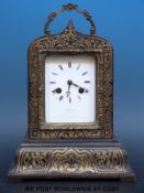 A boulle cased mantel clock with gilt handle and surround,