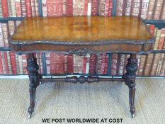A 19thC walnut and carved library table with turned legs and stretcher (width 110cm, depth 61cm,