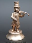 A white metal model of a violinist with Spanish silver marks to base,