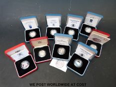 Nine silver proof £1 cased coins