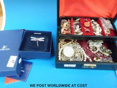 A collection of costume jewellery to include a boxed Swarovski brooch in the form of a dragonfly