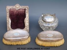 A pair of hallmarked silver-backed brushes,