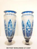 A pair of flash overlaid cut glass with blue staining over clear ground, 31cm tall.