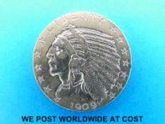 A 1909 gold Indian head five dollar coin