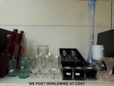 A collection of various clear and coloured glassware to include Dartington champagne flutes etc