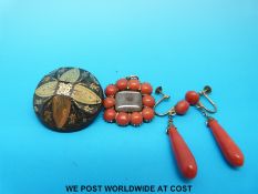 A jet brooch with gold inlaid decoration,