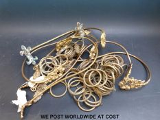 A set of six gilt curtain tiebacks together with a quantity of similar curtain furniture