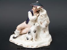 A late 18th/19thC Staffordshire figure of a boy with his dog (12cm tall)