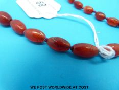 A carnelian agate necklace of oval beads (length 108cm)