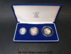 A set of three Piedfort coins comprising a 2001 £1 example,