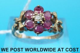A 9ct gold ring set with rubies and a diamond (size O)