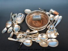 A collection of silver plate to include Walker & Hall teaspoons and tongs, mustard pot,