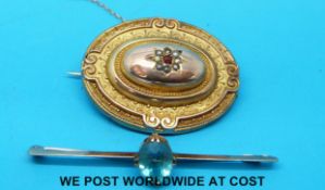 A 9ct gold brooch set with a garnet and small pearls together with 9ct gold brooch with a zircon