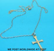 A yellow metal necklace with 9ct gold stylized cross (1.