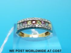 A 9ct gold ring set with diamonds and a row of multi coloured sapphires (size N)