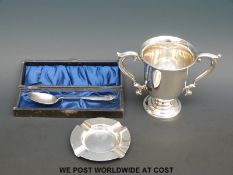 A George V hallmarked silver two-handled trophy or similar cup, height 11cm, Sheffield 1927,