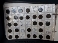 A large collection of farthings in an album, Charles II onwards, includes Victoria bun head,
