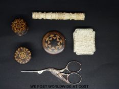 A Tunbridge ware needle case, thread wax and tape measure, an ivory needle case,