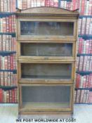 An oak Globe Wernicke style five section bookcase with up and over doors (width 88cm, depth 38cm,