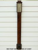 A Georgian flame mahogany stick barometer by Ramsden,