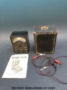 A cased Avo Minor electrical test meter with probes