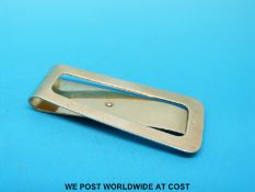 A 9ct gold money clip (10.