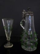 A late 19thC German ale jug with pewter top depicting a drinking elf together with a conical ale