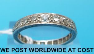 An Art Deco platinum eternity ring set with graduated diamonds around the band (size P)