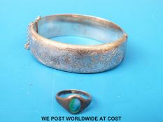 A Liberty and Co silver bangle and a Charles Horner ring set with enamel