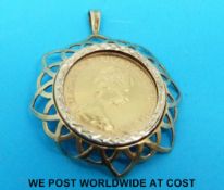 A 9ct gold pendant set with a 1976 gold full sovereign (11.