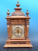 A late 19th / early 20thC two train mantel clock in carved and turned finialled case,
