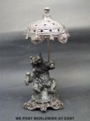 A patinated bronze or similar bear under a parasol (height 9cm)