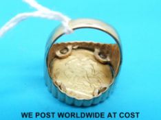 A 9ct gold ring set with a 1983 gold full sovereign (16.