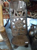 A carved hardwood Malawi chair (84cm tall)