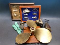 A brass/bronze ship or boat propeller together with a pair of port/starboard lights etc