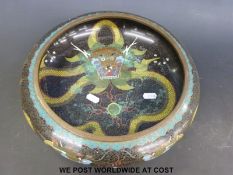 A Chinese cloisonne bowl with dragon decoration to the interior and exterior and four character