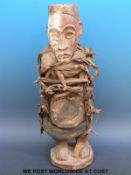 An African tribal figure of a man with nail and fabric decoration (51cm tall)